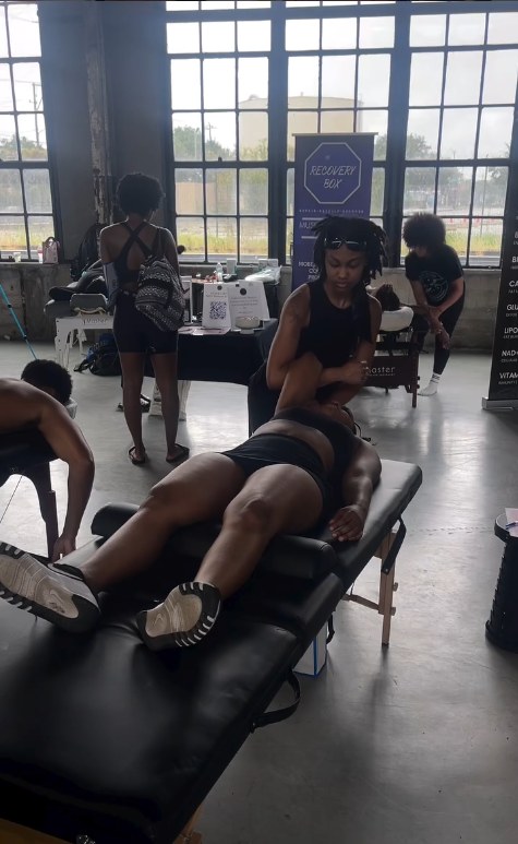 Holly O'Neal guiding an arm stretch